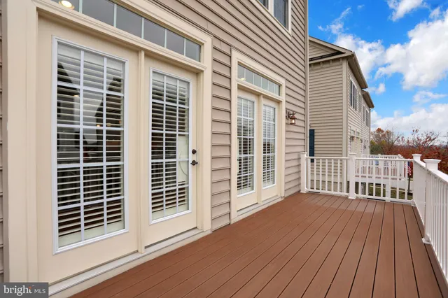 a view of backyard with a balcony