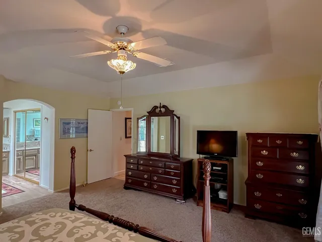 a bathroom with a tub sink and shower