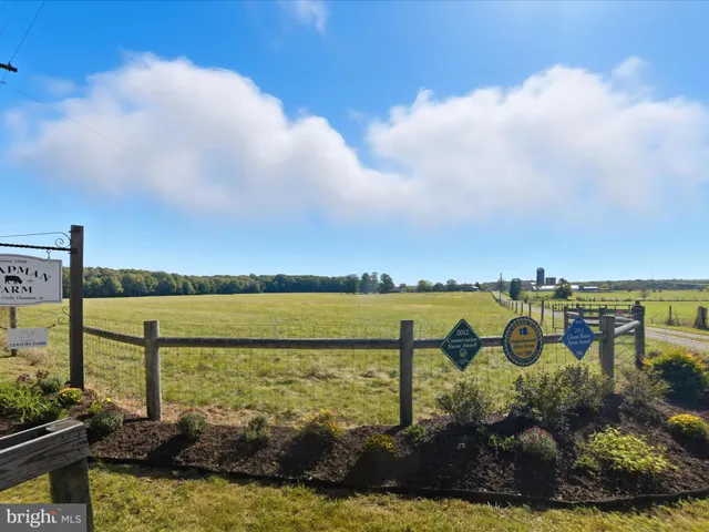 a aerial view of a house with a yard