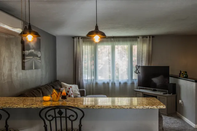 a kitchen with a table and chairs in it