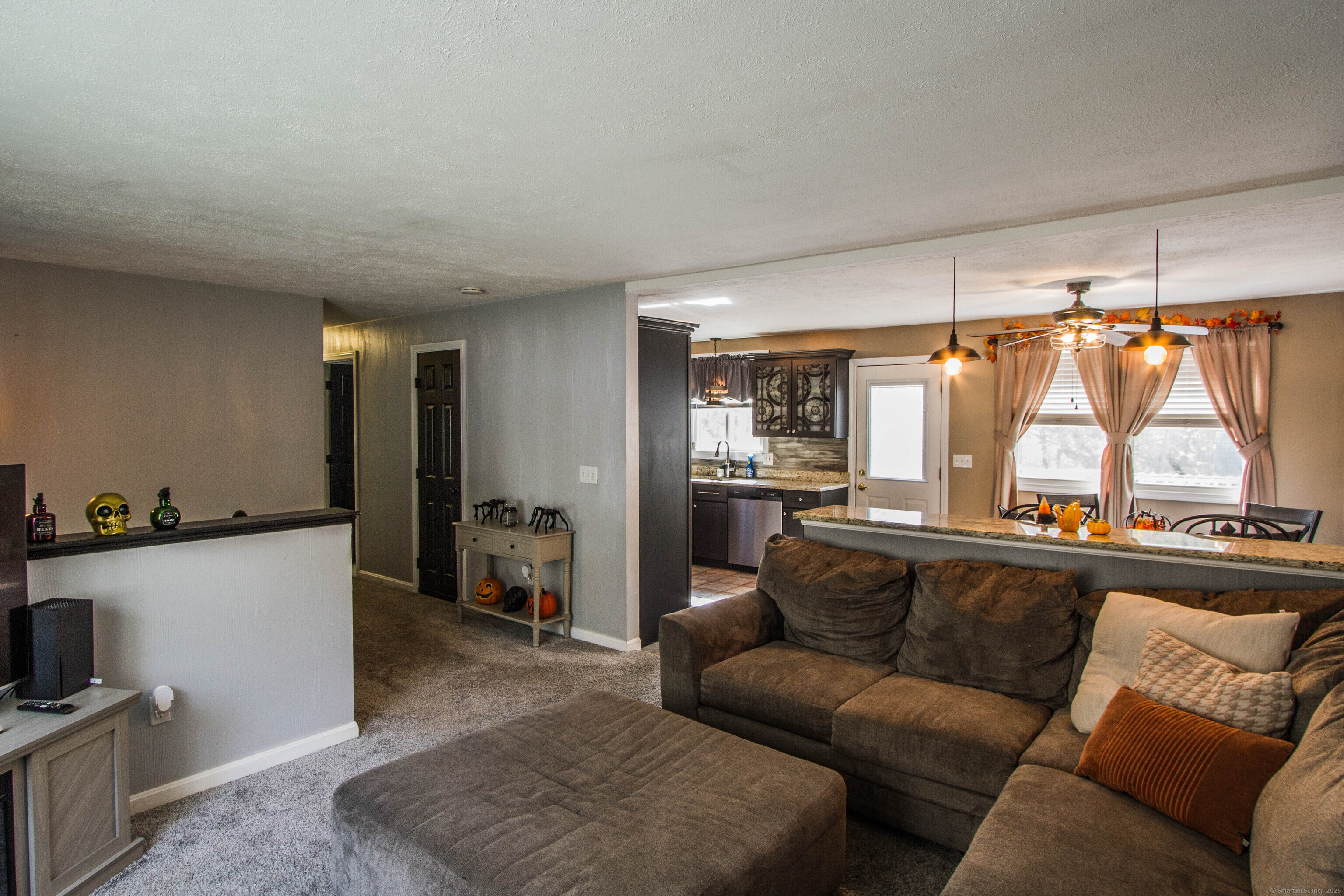 24 David Circle Putnam, CT 06260 - Photo 24 of 39 a view of a living room a couch and a window in a living room