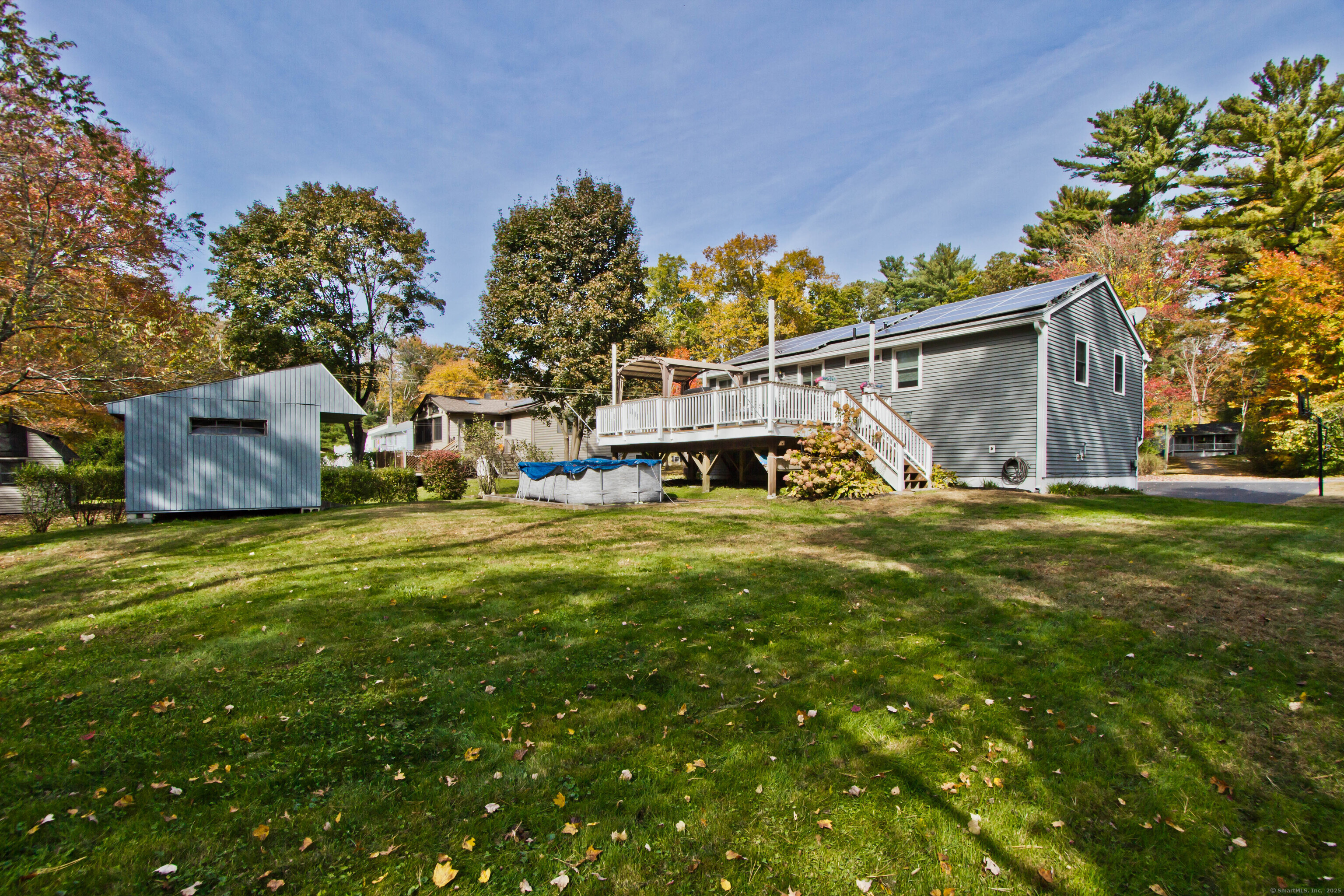 24 David Circle Putnam, CT 06260 - Photo 7 of 39 a view of a house with a big yard and large trees