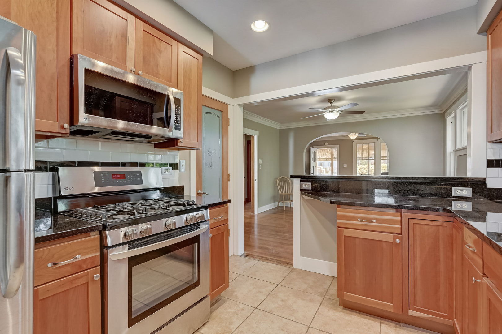 362 River Bluff Road Elgin, IL 60120 - Photo 22 of 57 a kitchen with stainless steel appliances granite countertop a stove a microwave and a sink