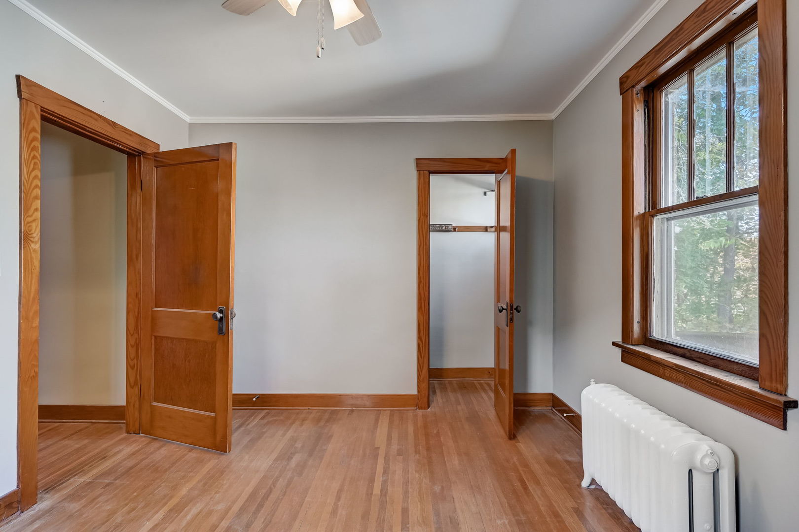 362 River Bluff Road Elgin, IL 60120 - Photo 24 of 57 an empty room with wooden floor cabinet and windows