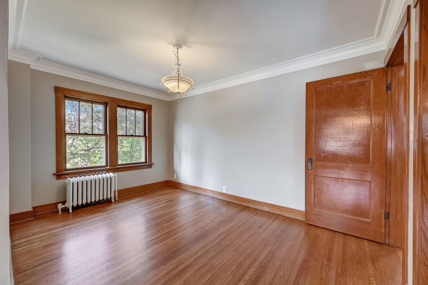 362 River Bluff Road Elgin, IL 60120 - Photo 35 of 57 an empty room with wooden floor chandelier and windows