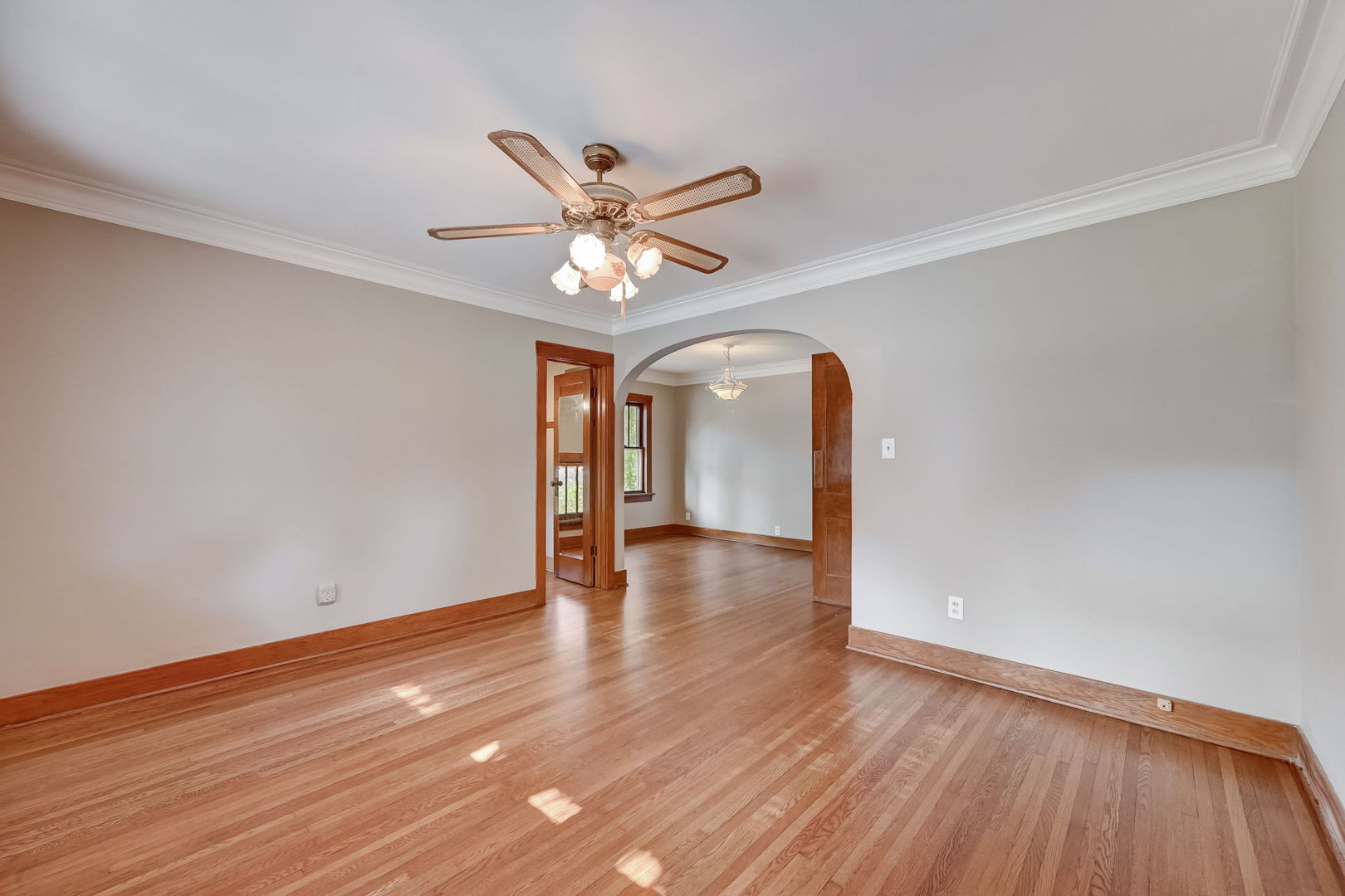 362 River Bluff Road Elgin, IL 60120 - Photo 37 of 57 a view of an empty room with wooden floor and a ceiling fan