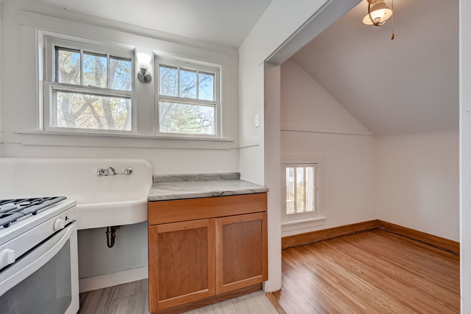362 River Bluff Road Elgin, IL 60120 - Photo 41 of 57 a kitchen with a wooden floor and a stove top oven