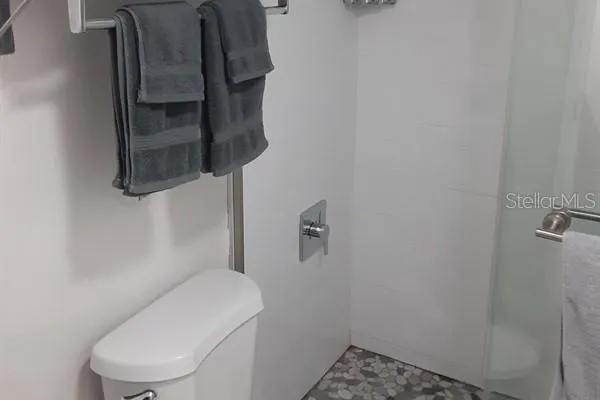 a bathroom with a toilet and a sink