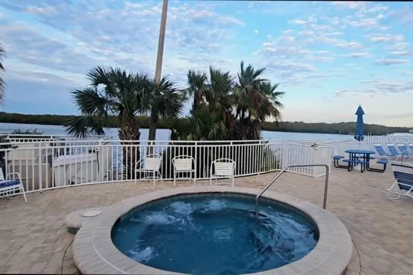 a view of a swimming pool with a lounge chair