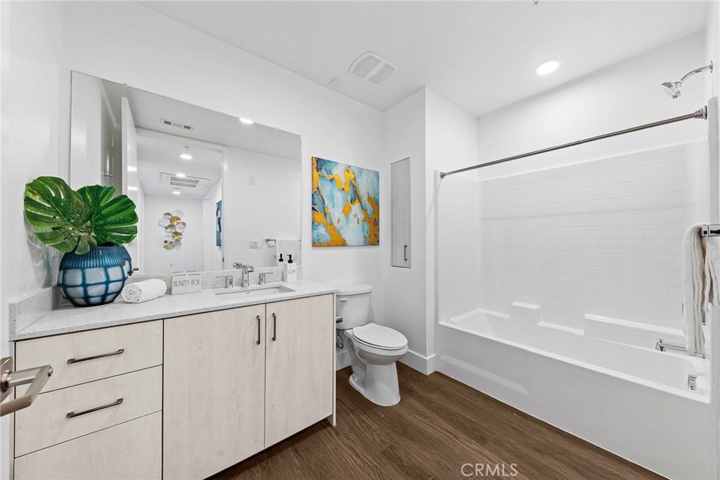 709 East Walnut Street, Unit 227 Pasadena, CA 91101 - Photo 21 of 42 a bathroom with a double vanity sink toilet and shower