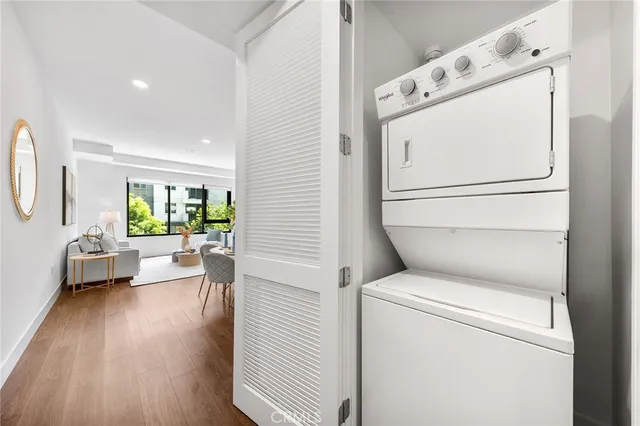 a view of washer and dryer with wooden floor