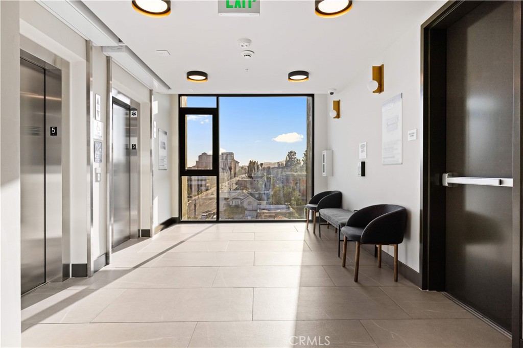 709 East Walnut Street, Unit 227 Pasadena, CA 91101 - Photo 30 of 42 a living room with furniture and a large window