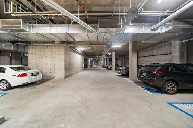 a view of parking garage with cars