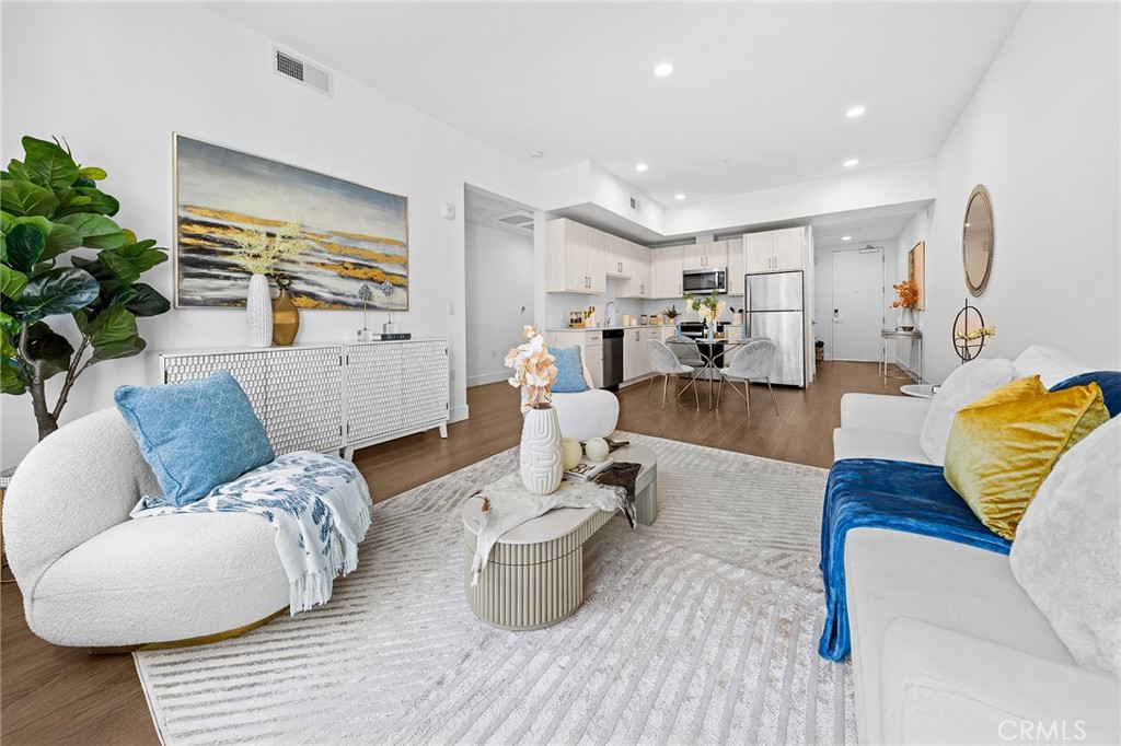 709 East Walnut Street, Unit 227 Pasadena, CA 91101 - Photo 4 of 42 a living room with furniture and wooden floor