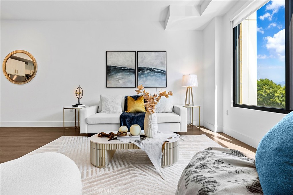 709 East Walnut Street, Unit 227 Pasadena, CA 91101 - Photo 6 of 42 a living room with furniture and a large window