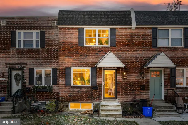 a front view of a house with glass windows