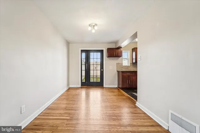 a view of a kitchen cabinets and wooden floor