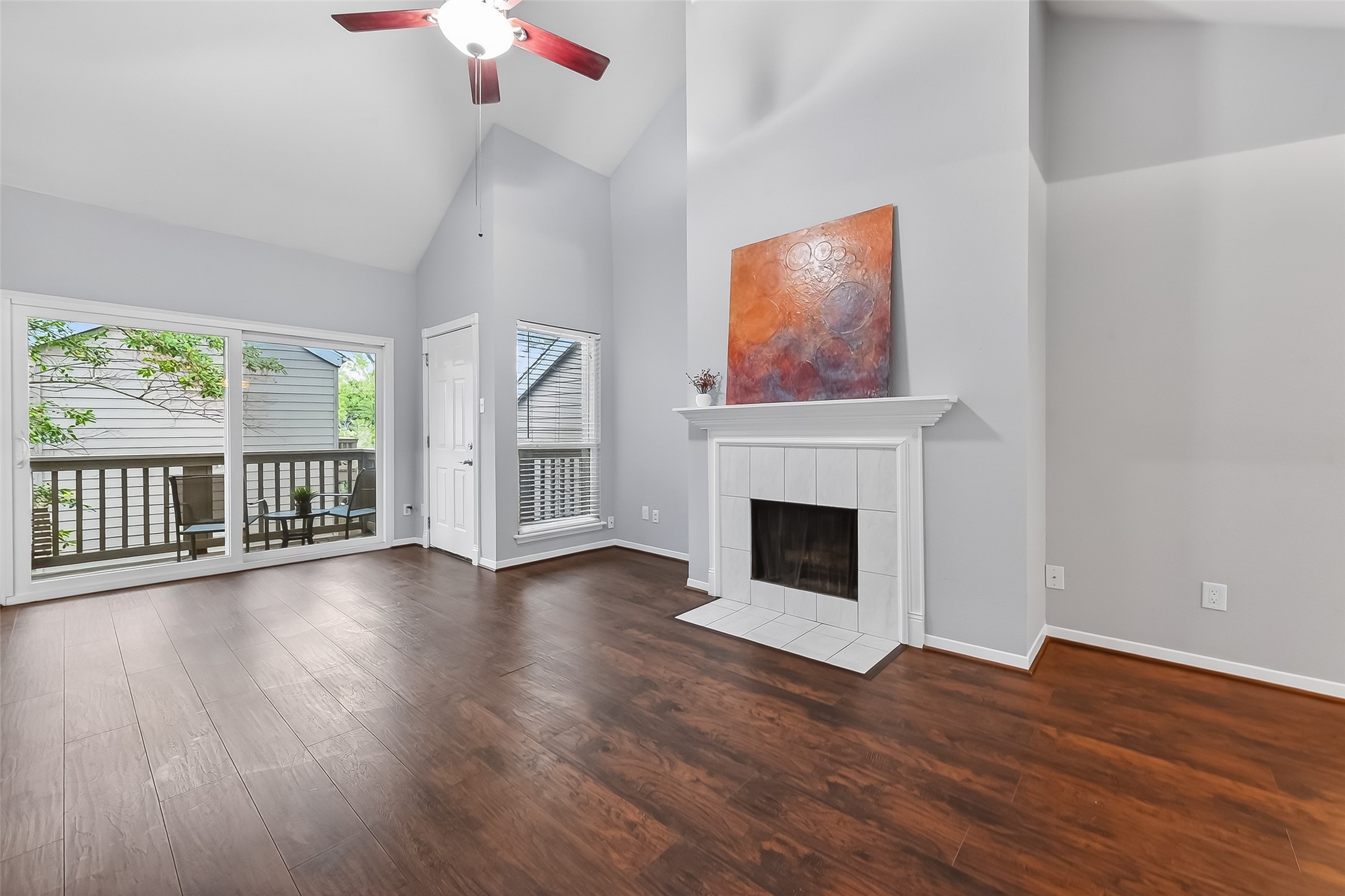 2100 Tanglewilde Street, Unit 740 Houston, TX 77063 - Photo 2 of 40 Spacious Living Room with soaring cathedral ceilings and wood burning fireplace