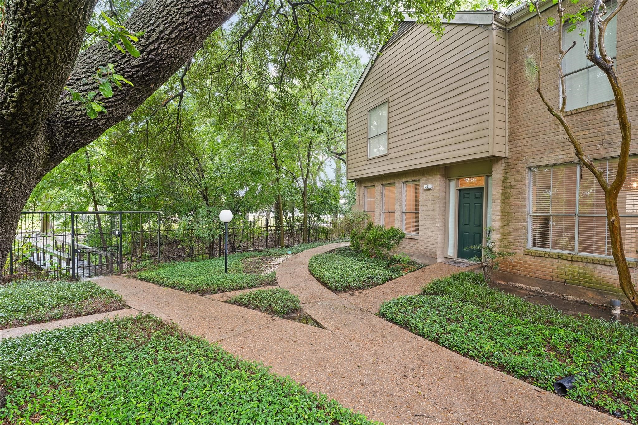 2100 Tanglewilde Street, Unit 740 Houston, TX 77063 - Photo 38 of 40 There is a bridge leading to the Woodlake Community Park with two fenced dog parks, tennis courts, pickle ball, a gazebo and picnic areas