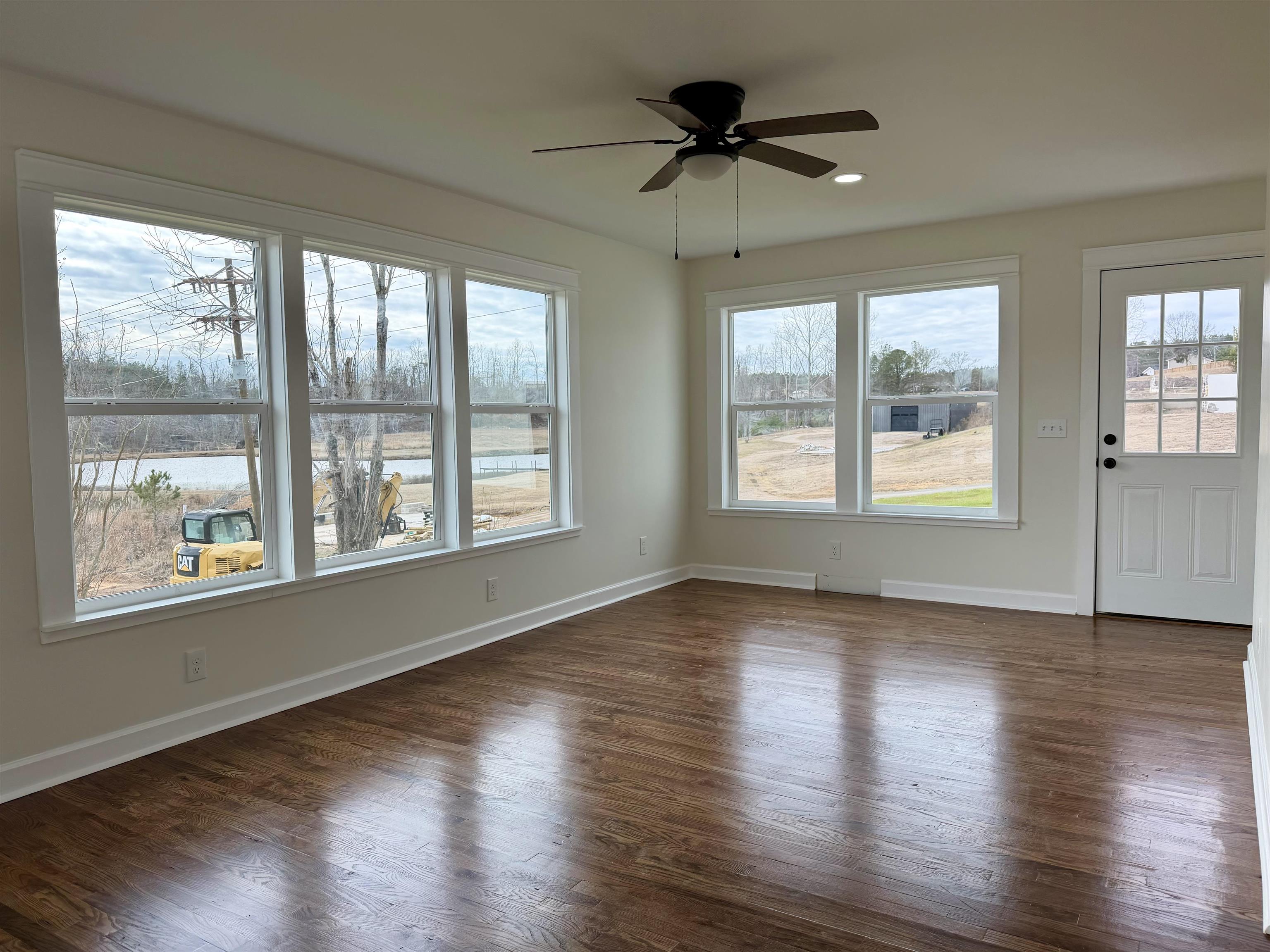 172 New Bethel Road Selmer, TN 38375 - Photo 18 of 30 a view of an empty room with wooden floor and a window