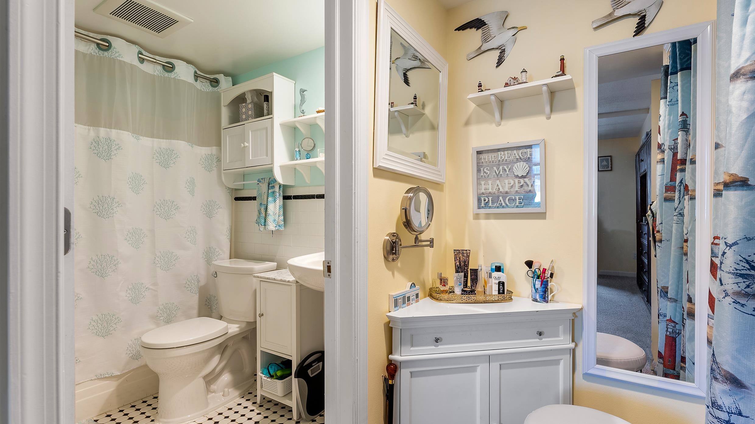 208 East Forget-Me-Not Road, Unit 103 Wildwood Crest, NJ 08260 - Photo 16 of 20 a bathroom with a toilet sink and shower curtain