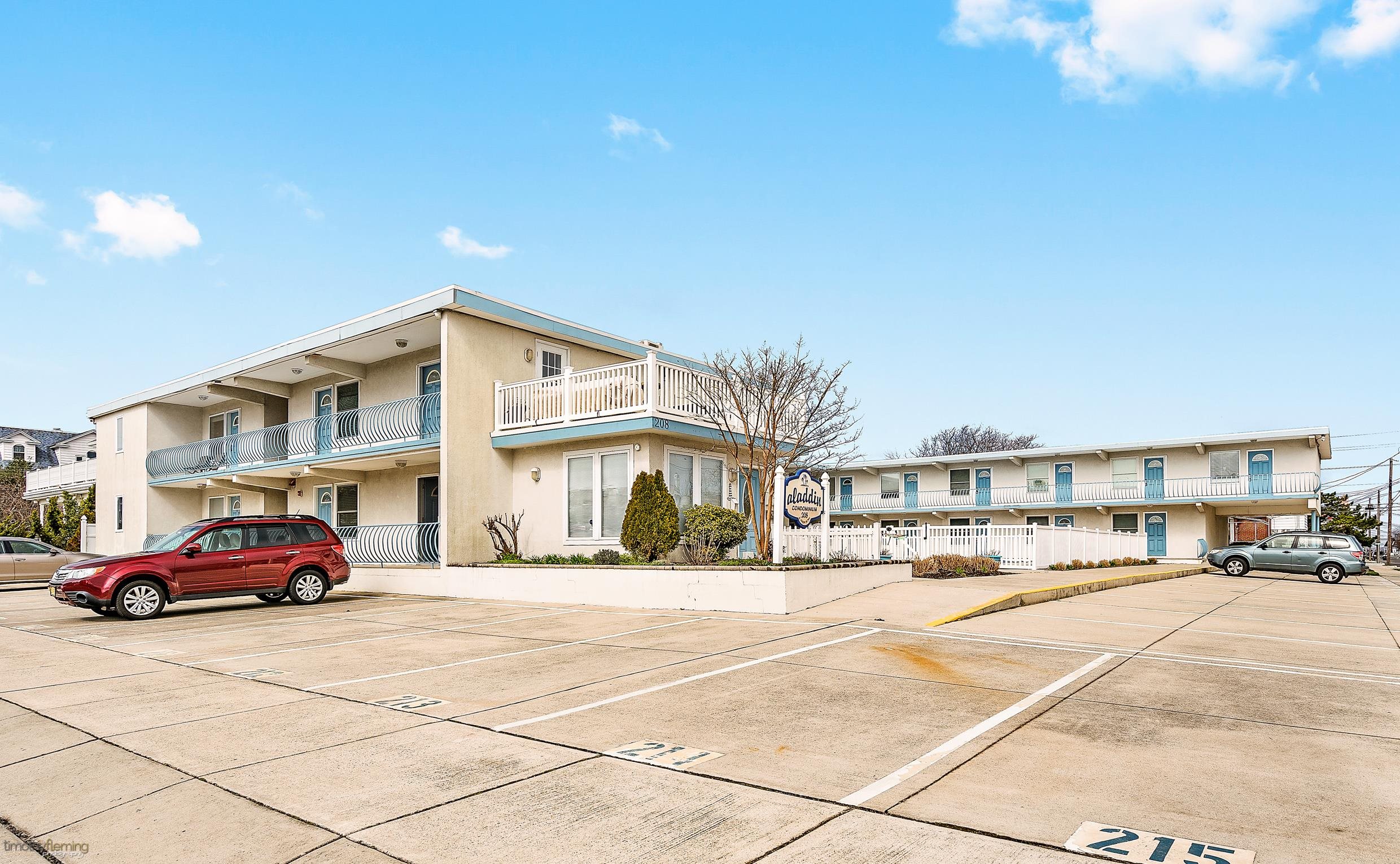 208 East Forget-Me-Not Road, Unit 103 Wildwood Crest, NJ 08260 - Photo 2 of 20 a building with trees in front of it