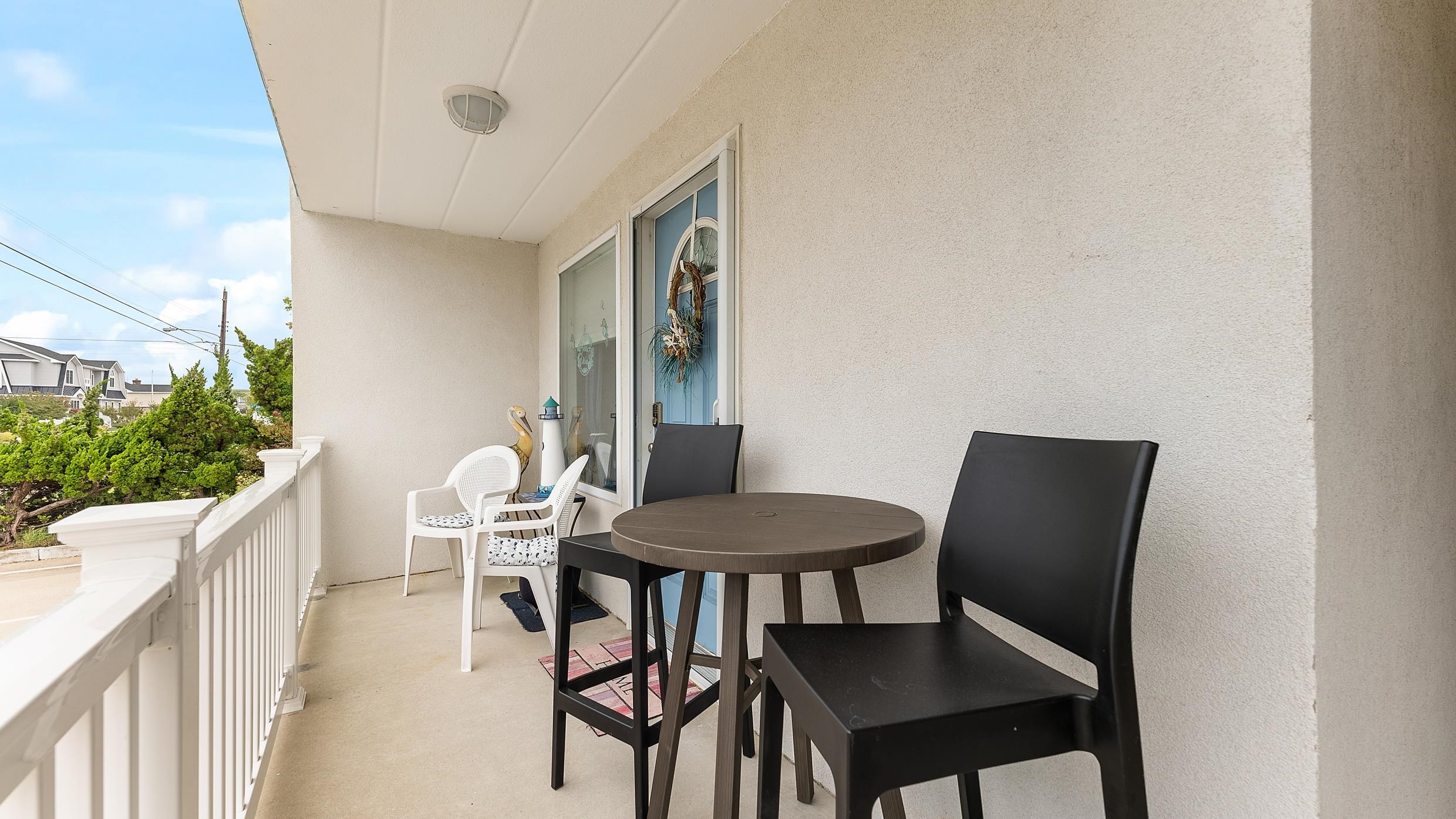 208 East Forget-Me-Not Road, Unit 103 Wildwood Crest, NJ 08260 - Photo 6 of 20 a view of a dining room with furniture and wooden floor