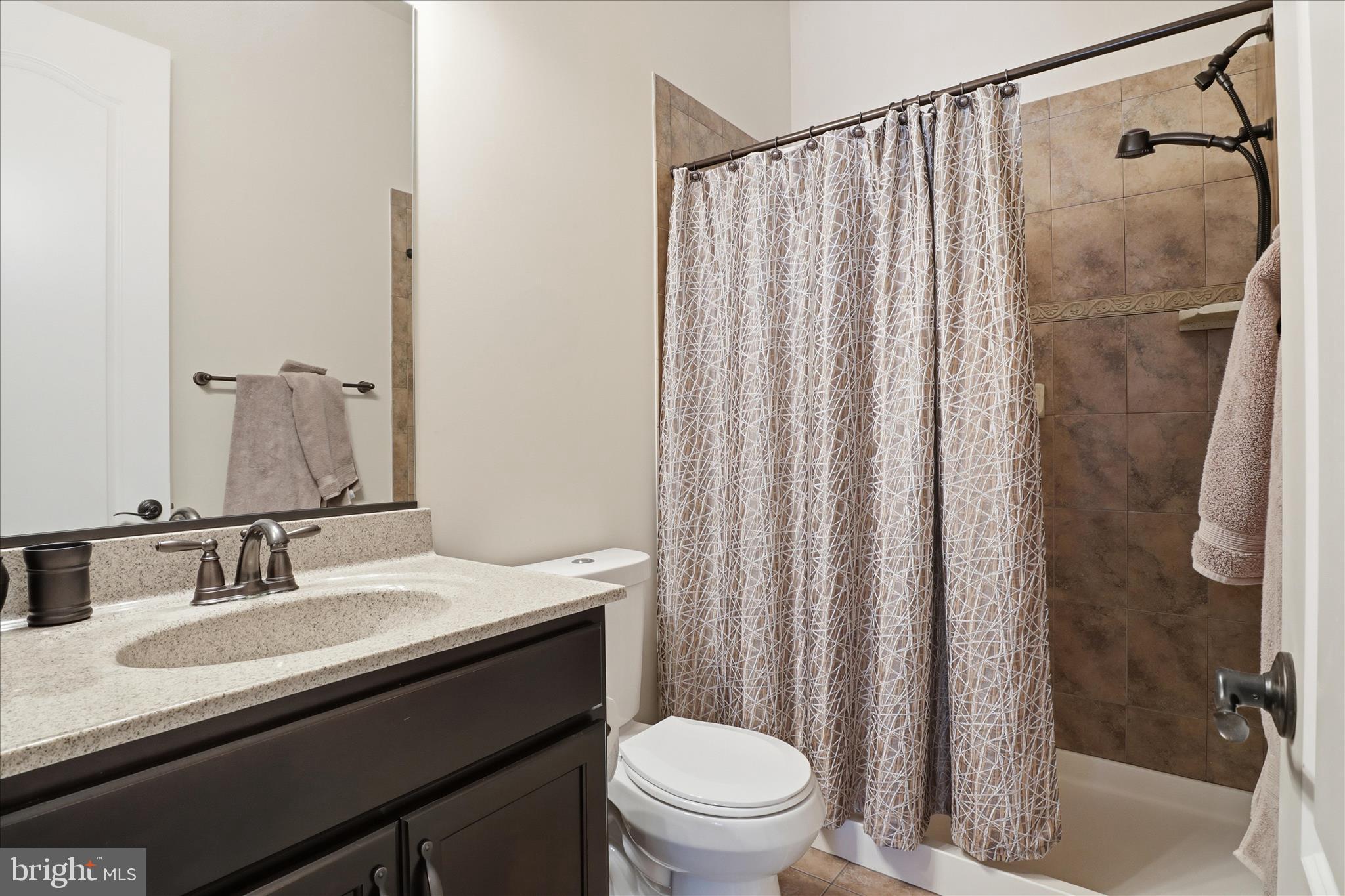7501 Clifton Road Clifton, VA 20124 - Photo 29 of 93 a bathroom with a sink a toilet and shower