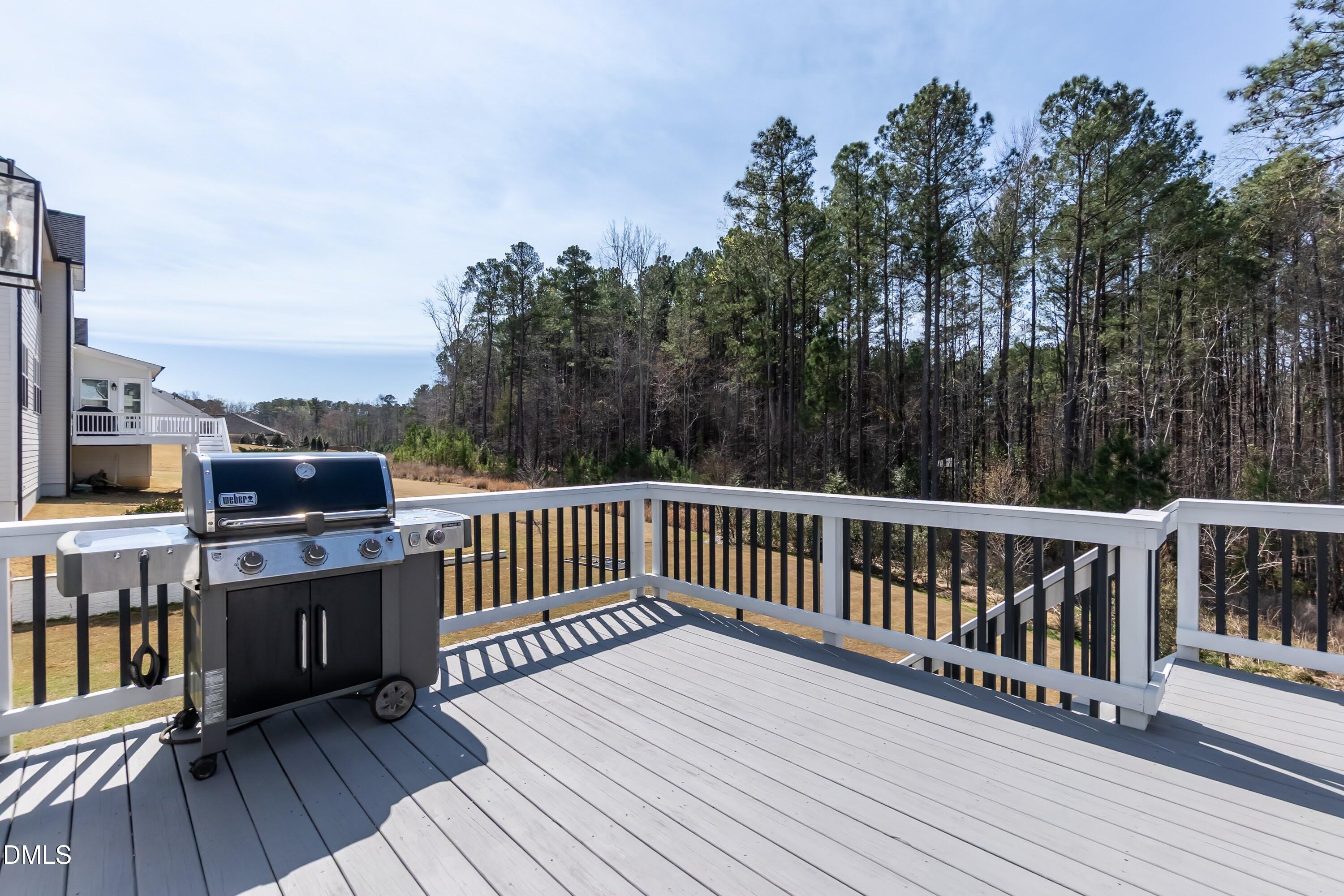441 Bertram Valley Road Apex, NC 27523 - Photo 11 of 77 Sits nice and high to overlook the protected tree area in the back