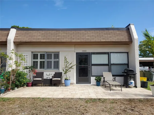 a backyard of a house with seating space