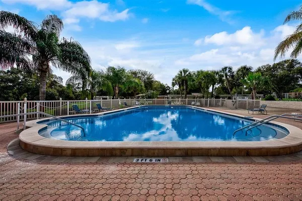 a view of a swimming pool with a yard