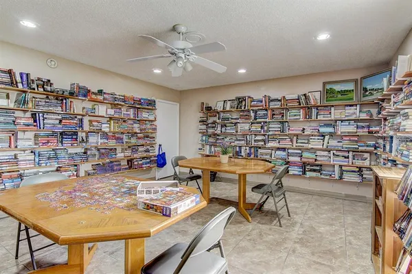 a room with furniture and a book shelf