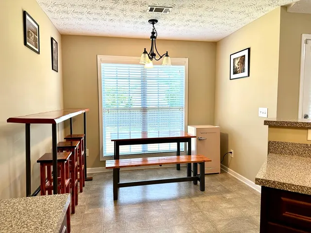 a bedroom with furniture and a window