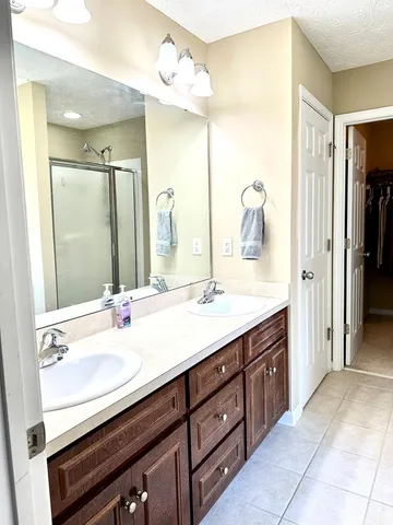 a bathroom with a double vanity sink mirror and double