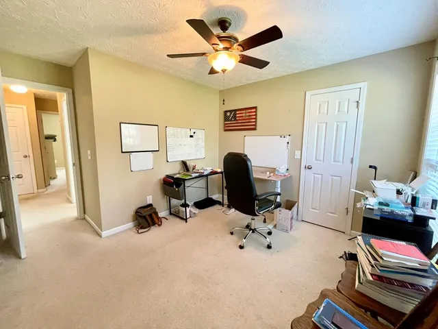 a room with gym equipment and a window
