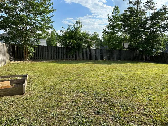 a swimming pool with wooden fence