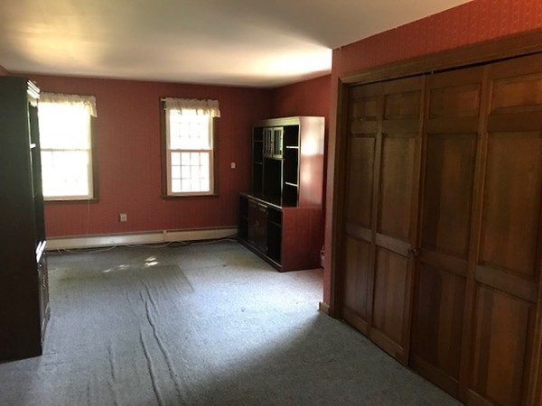 370 Winthrop Street Rehoboth, MA 02769 - Photo 11 of 22 en empty room with windows and furniture
