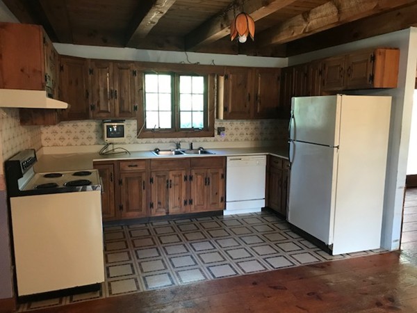 370 Winthrop Street Rehoboth, MA 02769 - Photo 3 of 22 a kitchen with a stove a refrigerator and cabinets