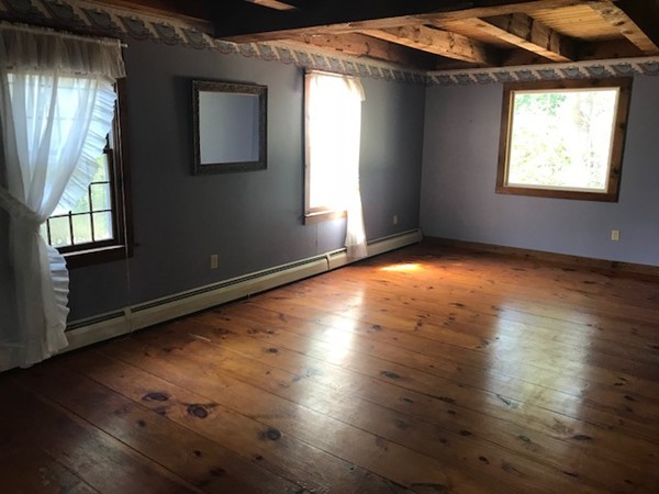370 Winthrop Street Rehoboth, MA 02769 - Photo 7 of 22 an empty room with wooden floor and windows