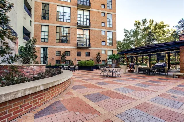 a view of a swimming pool with an outdoor space and seating area
