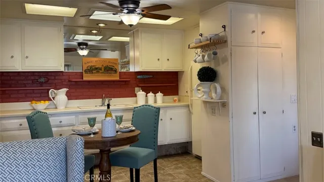 a kitchen with a stove and a refrigerator