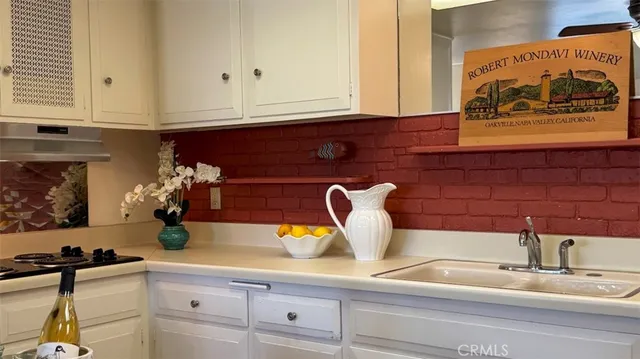 a kitchen with appliances and cabinets