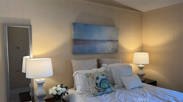 a bed room with a bed and a night stand