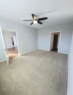 a view of a livingroom with a ceiling fan