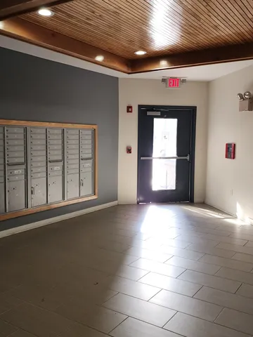 a view of empty room with a fireplace