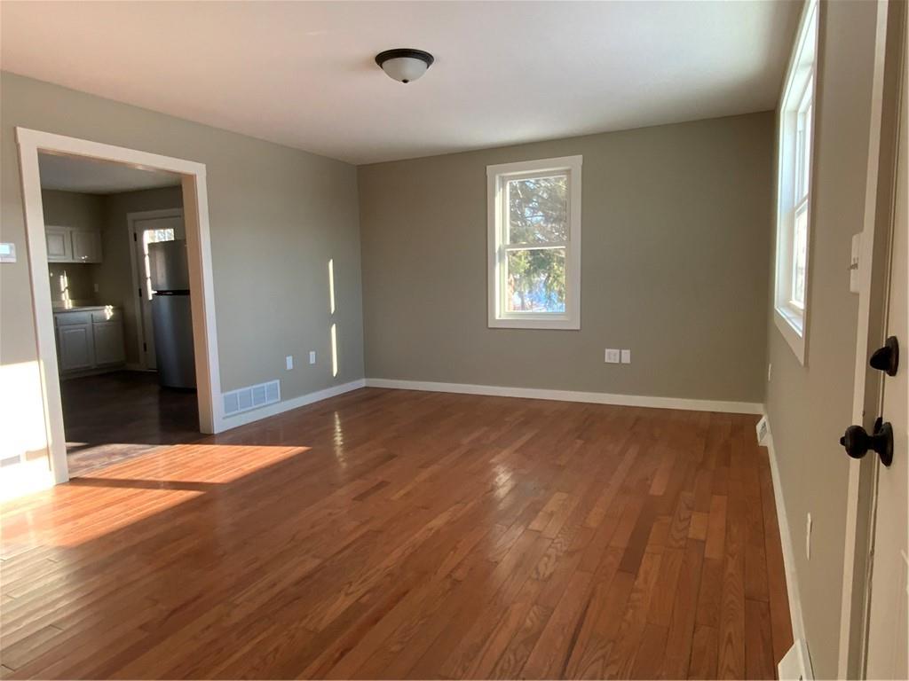75 Meneely Road Burgettstown, PA 15021 - Photo 2 of 11 an empty room with wooden floor and windows