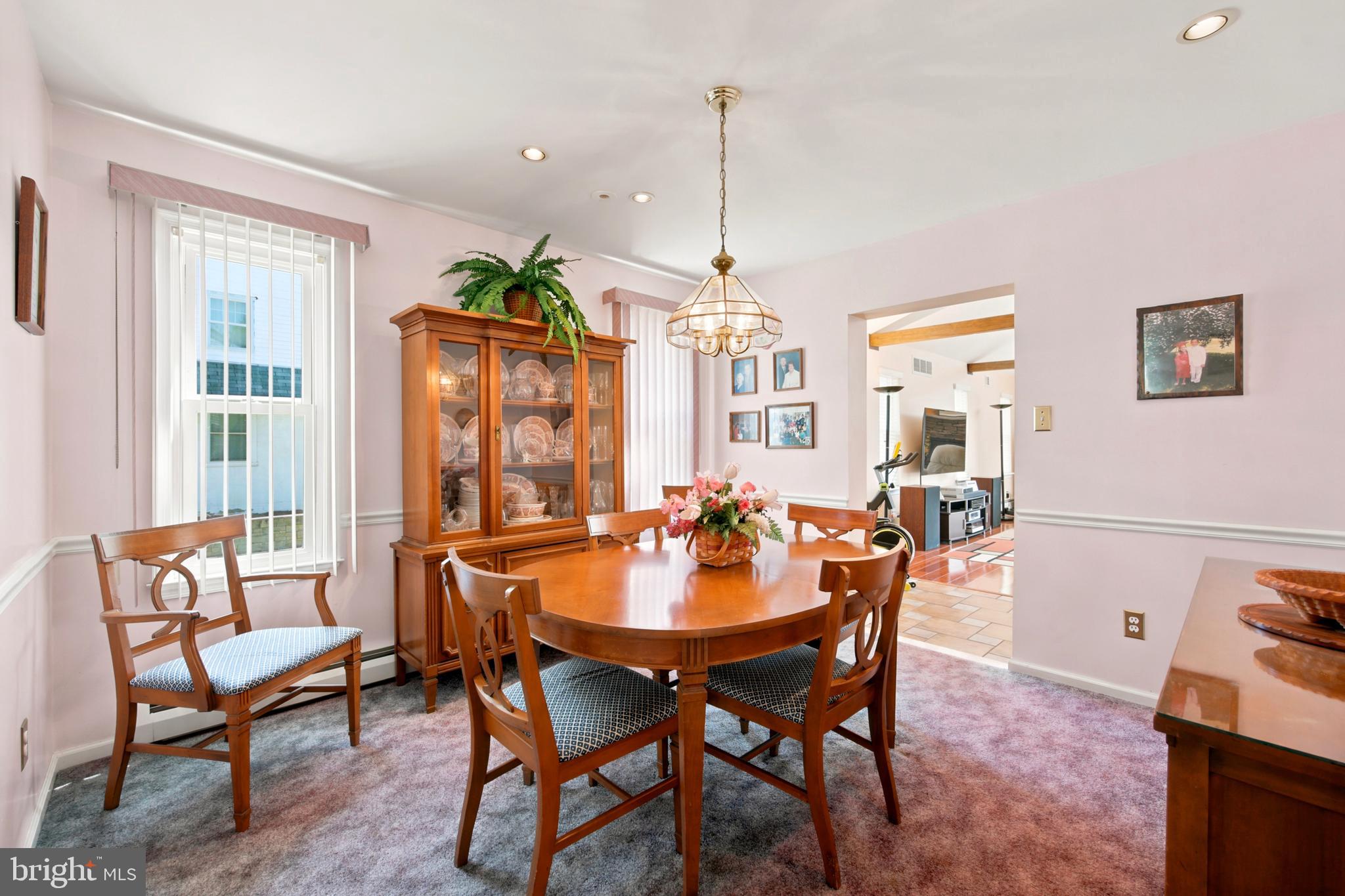 1004 Green Lane Secane, PA 19018 - Photo 16 of 49 a dining room with furniture a chandelier and wooden floor