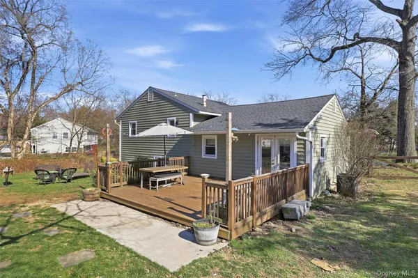a view of a house with wooden fence