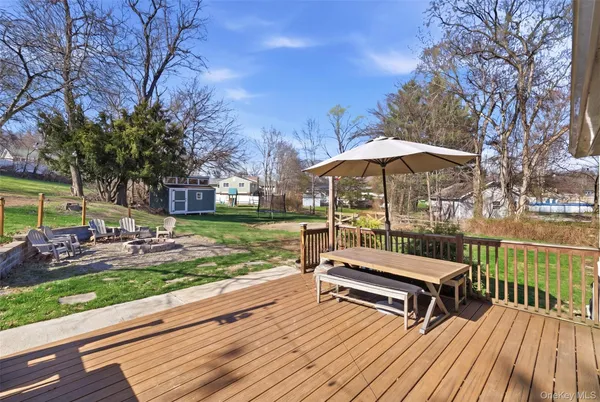 a view of backyard with sitting area and wooden floor