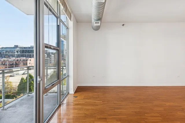 wooden floor in an empty room with a balcony